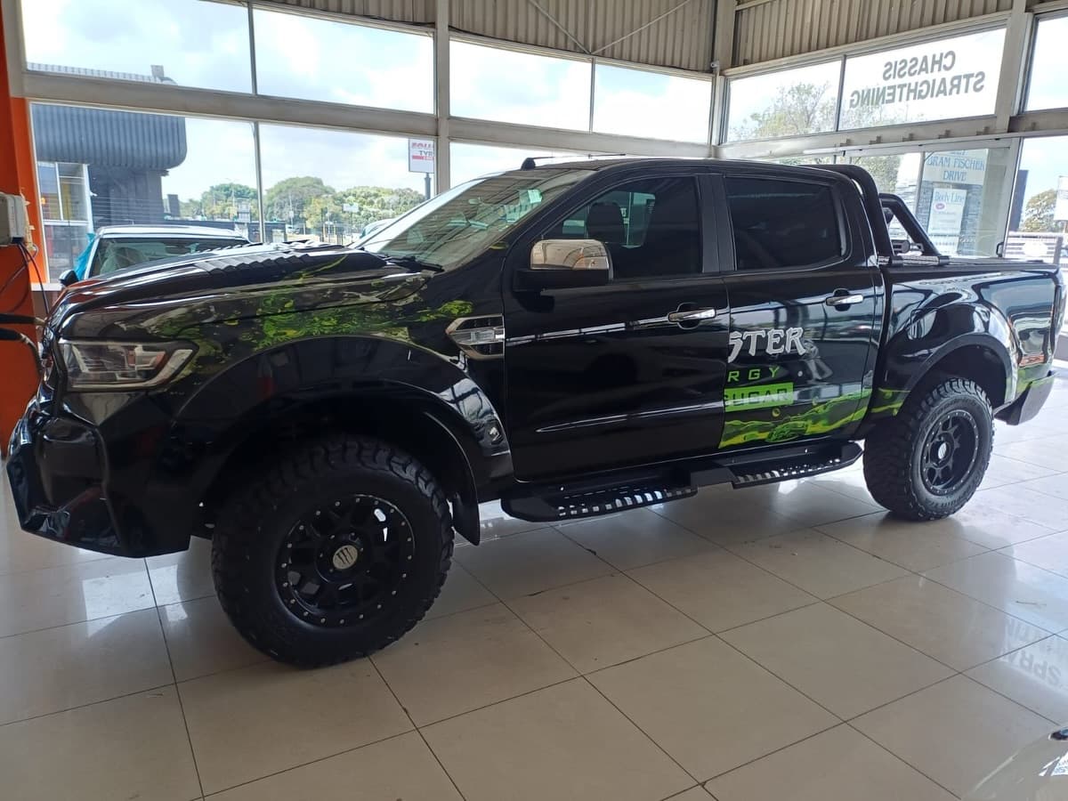 Side profile, parked in the showroom