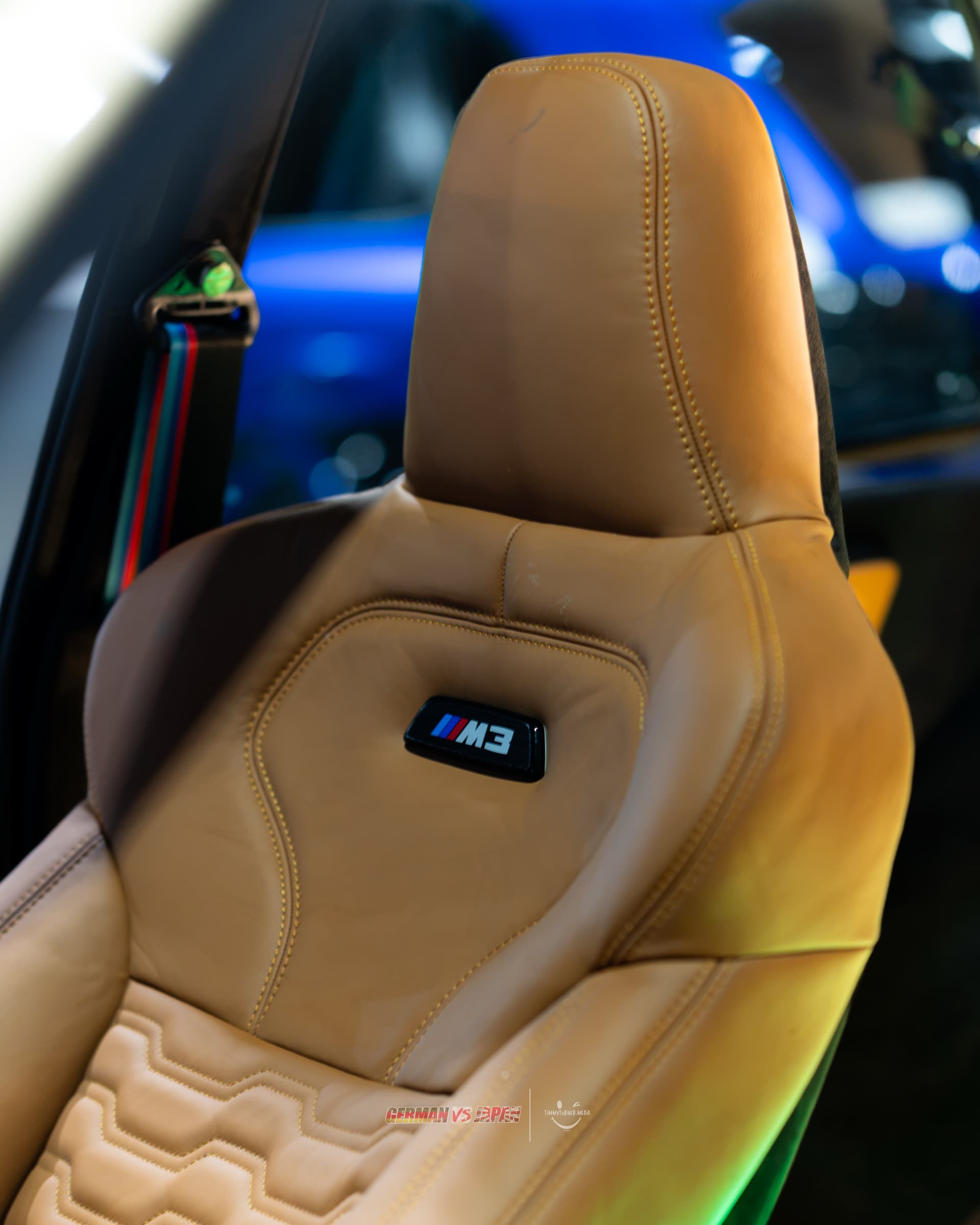 M3 badging on the tan leather headrest