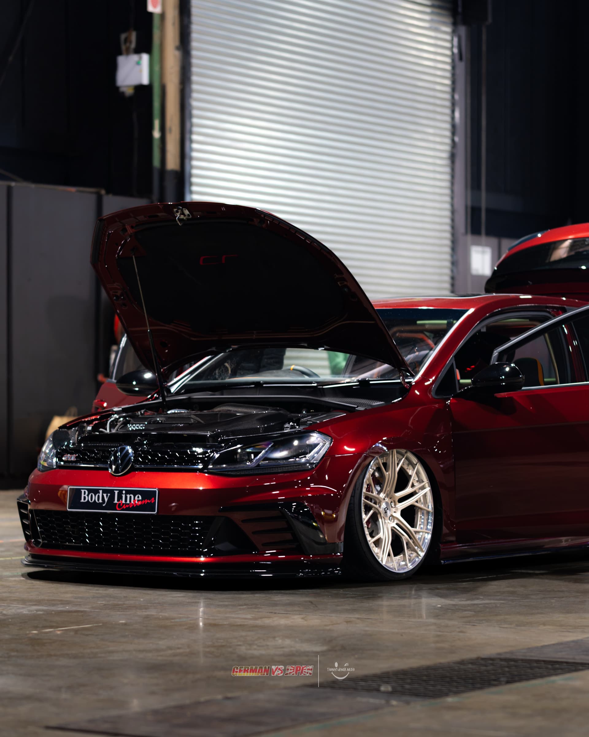 The Body Line Customs plate on the red Golf R build