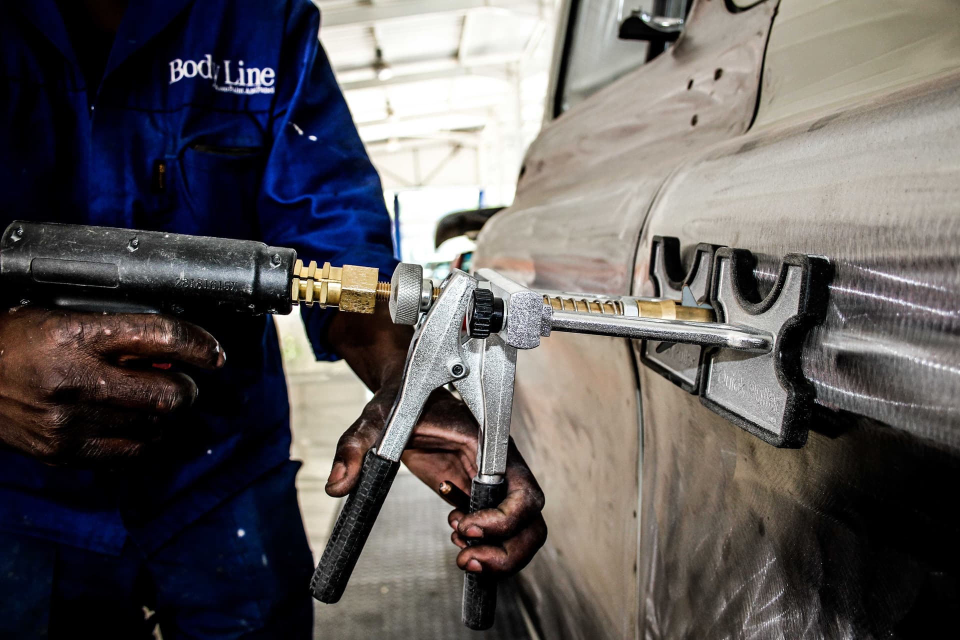 Precision panel repair, tool in hand